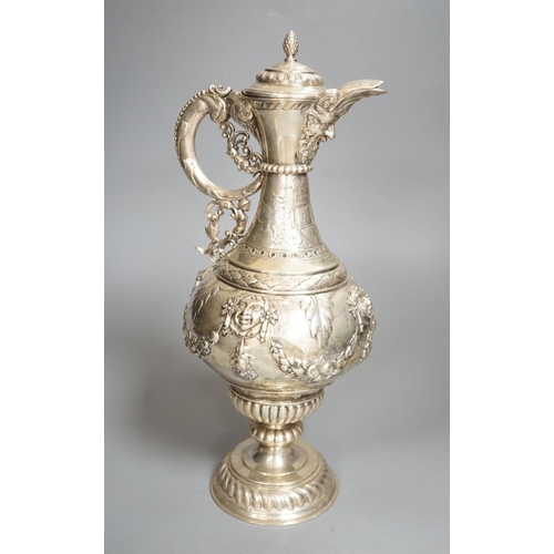 1819 - A 19th century Continental white metal wine ewer, embossed with swags and masks, height 29.9cm, 16.5... 