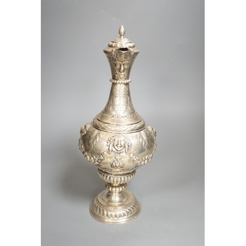 1819 - A 19th century Continental white metal wine ewer, embossed with swags and masks, height 29.9cm, 16.5... 