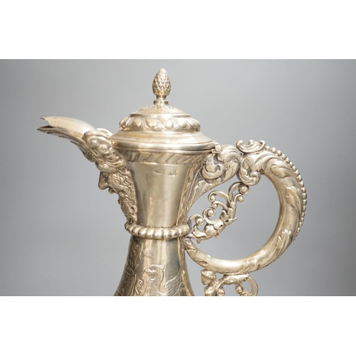 1819 - A 19th century Continental white metal wine ewer, embossed with swags and masks, height 29.9cm, 16.5... 