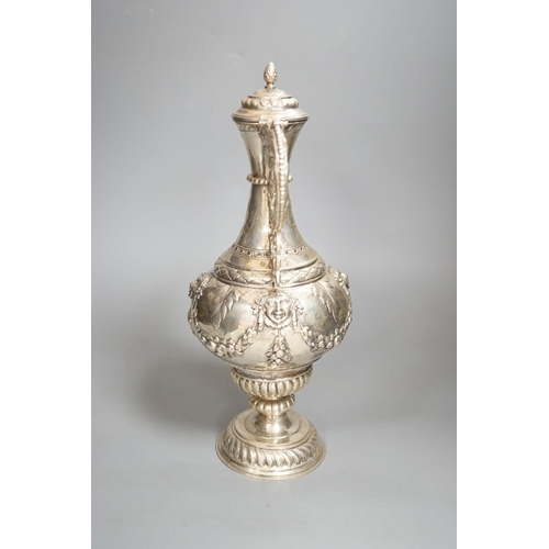 1819 - A 19th century Continental white metal wine ewer, embossed with swags and masks, height 29.9cm, 16.5... 