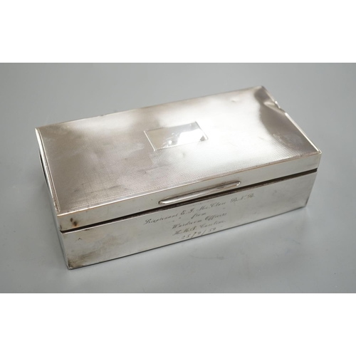 1825 - A late 1950's engine turned silver mounted rectangular cigarette box, with engraved inscription, 17.... 