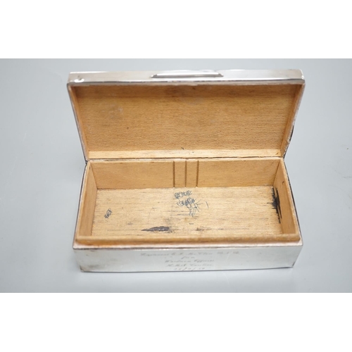 1825 - A late 1950's engine turned silver mounted rectangular cigarette box, with engraved inscription, 17.... 