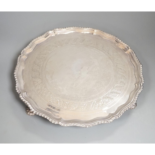 1827 - A George III silver salver, with gadrooned border, on three shell feet, Ebenezer Coker, London, 1773... 