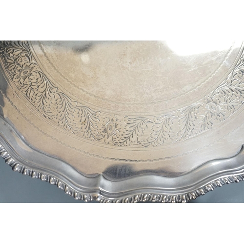 1827 - A George III silver salver, with gadrooned border, on three shell feet, Ebenezer Coker, London, 1773... 