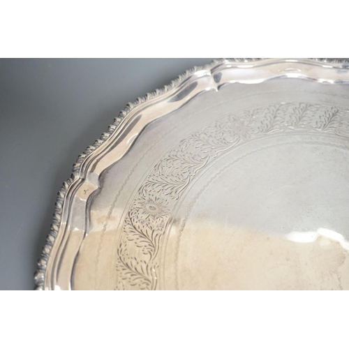 1827 - A George III silver salver, with gadrooned border, on three shell feet, Ebenezer Coker, London, 1773... 