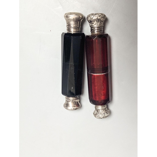 1830 - Two Victorian white metal mounted green or ruby glass double ended scent bottles, largest 13cm.... 