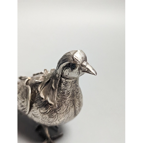 1832 - A late 19th century Hanau 800 white metal novelty condiment?, modelled as a game bird, with articula... 