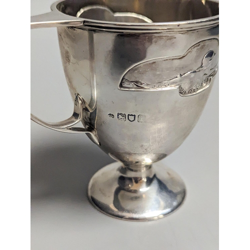 1833 - An Edwardian Art Nouveau silver pedestal christening mug, by William Hutton & Sons, London, 1904, 97... 