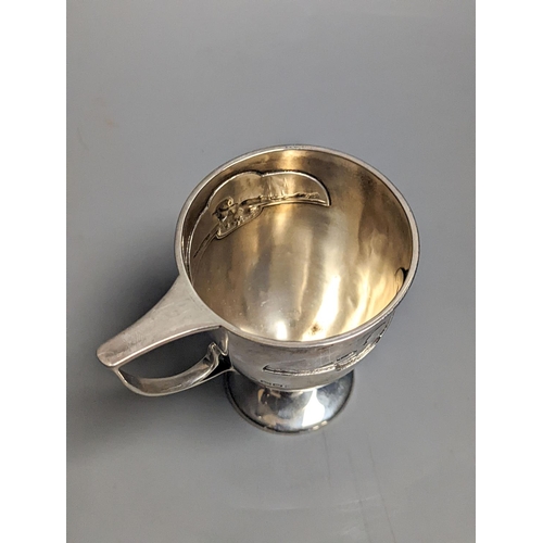 1833 - An Edwardian Art Nouveau silver pedestal christening mug, by William Hutton & Sons, London, 1904, 97... 