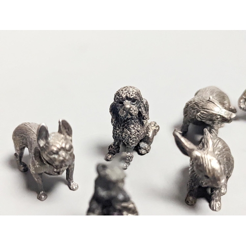 1840 - Four modern miniature freestanding model animals, including, badger, two dogs and a cat, JJSM, Londo... 