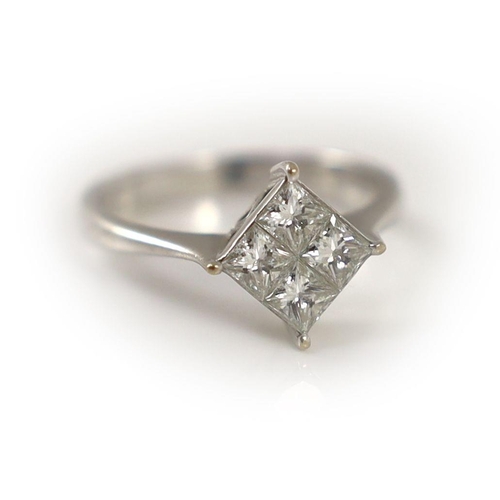 1875 - A modern 18k white gold and princess cut diamond set four stone cluster ring,size O, gross weight 3.... 