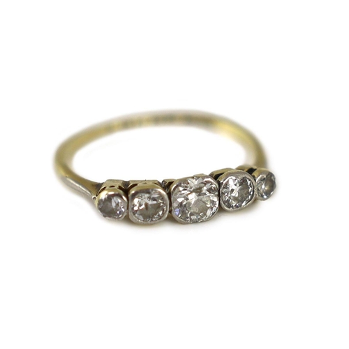 1876 - An early 20th century 18ct gold, platinum and graduated collet set five stone diamond ring,size N, g... 