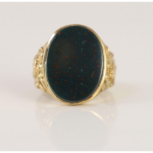 1877 - A 1970's 9ct gold and oval bloodstone set signet ring,with ornate carved shoulders, size P/Q, gross ... 