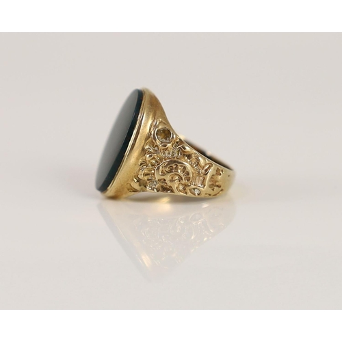 1877 - A 1970's 9ct gold and oval bloodstone set signet ring,with ornate carved shoulders, size P/Q, gross ... 