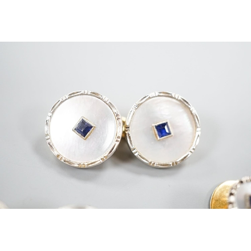 1878 - A pair of 18ct, mother of pearl and sapphire set circular cufflinks, 13mm and a pair of matching dre... 