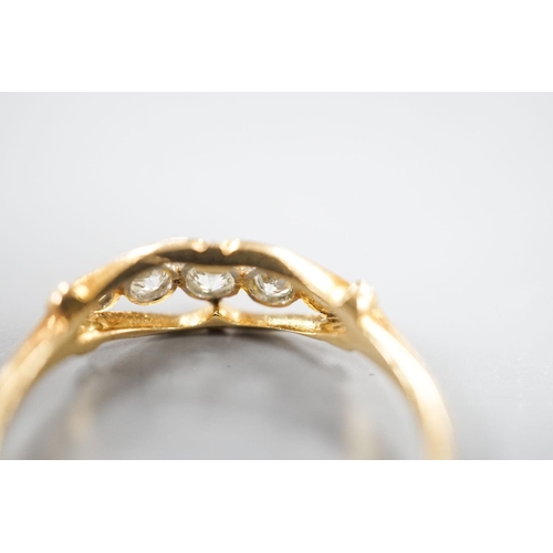 1880 - An 18ct and graduated five stone millegrain set diamond ring, size U/W, gross 2.6.