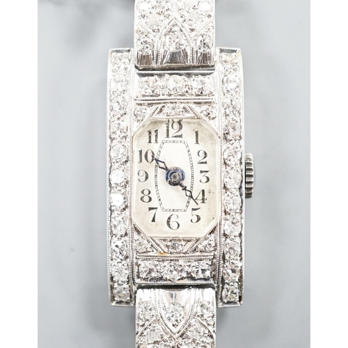 1883 - A lady's white metal (stamped platinum) and diamond set cocktail watch, the bracelet with diamond se... 