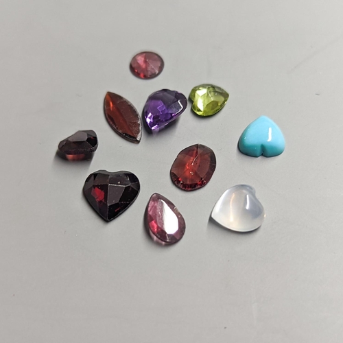 1955 - Nine assorted unmounted cut semi-precious gemstones including amethyst and garnet.