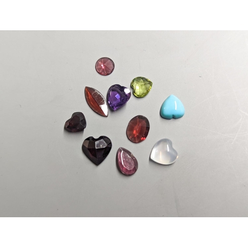 1955 - Nine assorted unmounted cut semi-precious gemstones including amethyst and garnet.