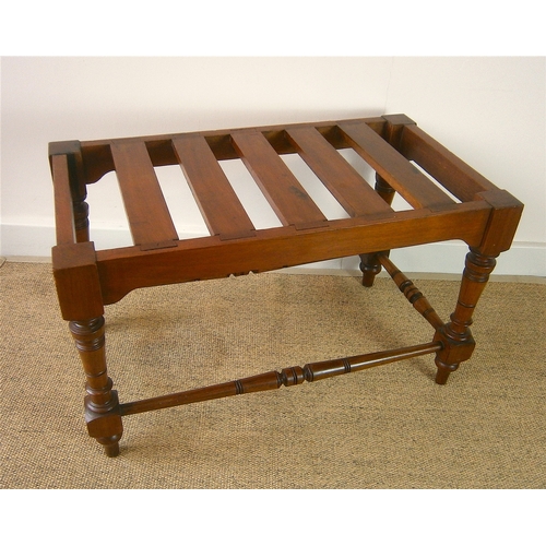 1164 - A late Victorian aesthetic movement walnut luggage stand, length 69cm, depth 38cm, height 41cm... 