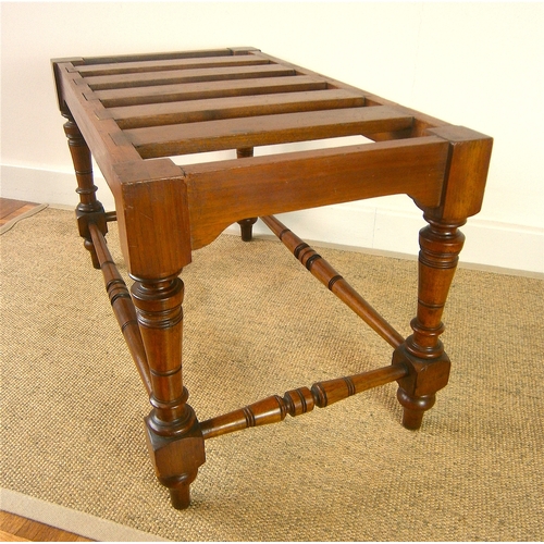 1164 - A late Victorian aesthetic movement walnut luggage stand, length 69cm, depth 38cm, height 41cm... 