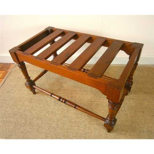 1164 - A late Victorian aesthetic movement walnut luggage stand, length 69cm, depth 38cm, height 41cm... 