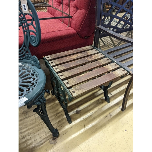 1061 - A circular painted aluminium garden table, diameter 60cm, height 62cm together with two chairs... 