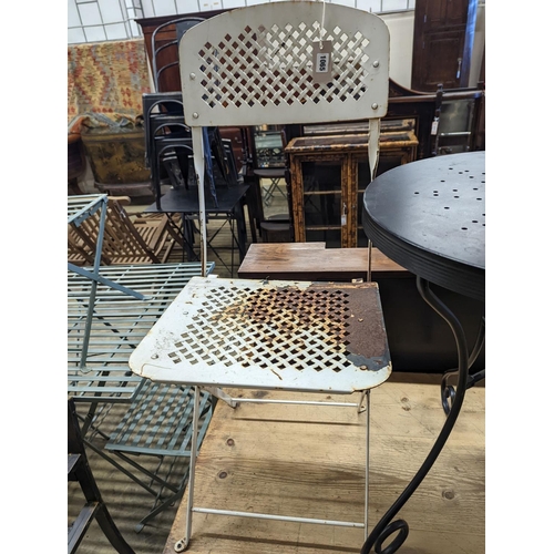 1065 - A circular metal bistro table, diameter 49cm, height 65cm and two chairs