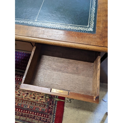 1079 - An Edwardian faded mahogany pedestal desk, stamped T. Willson, Great Queen Street, London, length 13... 