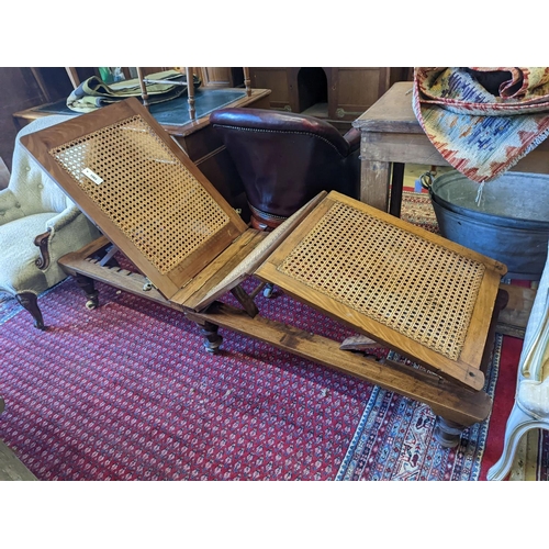 1083 - A 19th century caned campaign daybed, length 182cm, depth 56cm