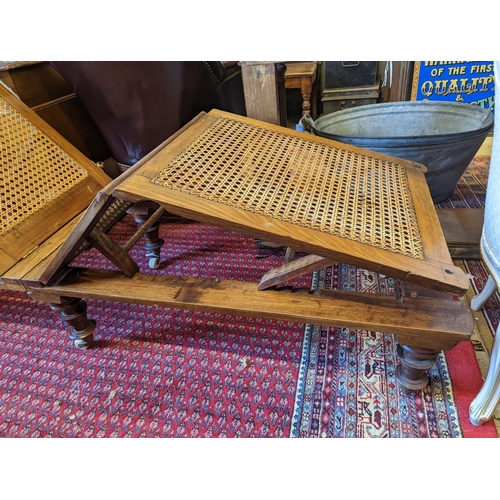 1083 - A 19th century caned campaign daybed, length 182cm, depth 56cm