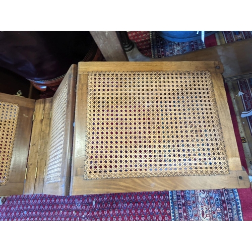 1083 - A 19th century caned campaign daybed, length 182cm, depth 56cm