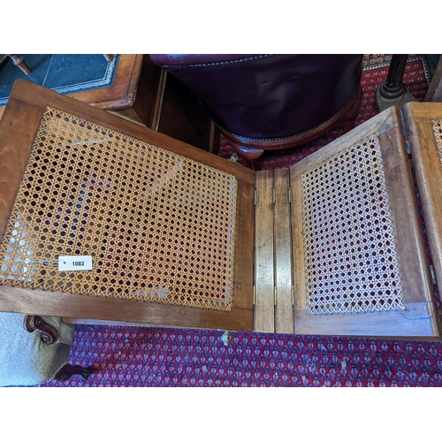 1083 - A 19th century caned campaign daybed, length 182cm, depth 56cm