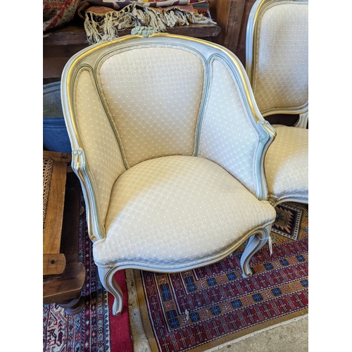 1085 - A Louis XVI style painted upholstered tub chair and a similar side chair