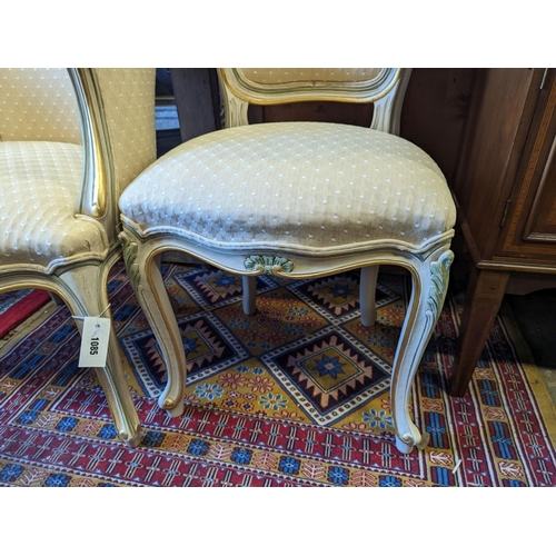 1085 - A Louis XVI style painted upholstered tub chair and a similar side chair