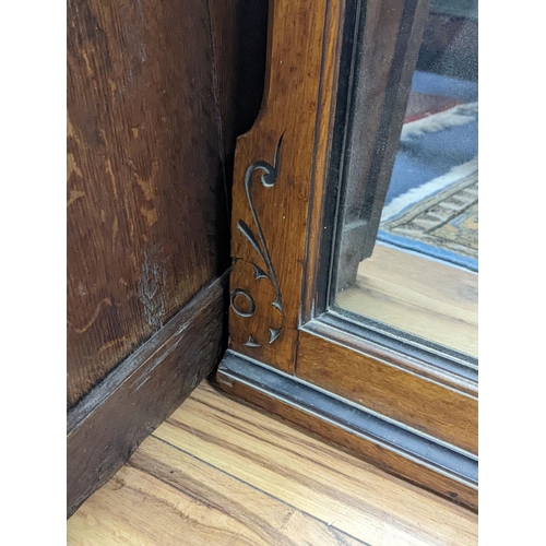 1095 - A large late Victorian aesthetic movement part ebonised oak overmantel mirror, width 162cm, height 1... 