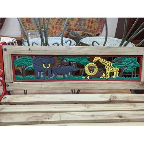 1117 - A painted metal child's garden bench, width 85cm, height 52cm