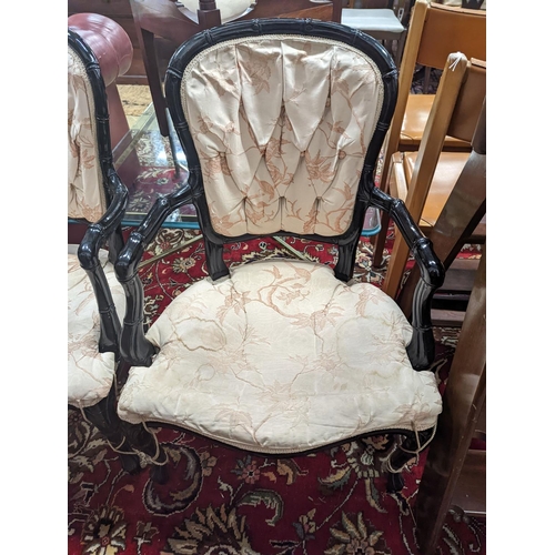 26 - A pair of ebonised simulated bamboo open armchairs, width 59cm, depth 54cm, height 90cm