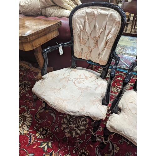 26 - A pair of ebonised simulated bamboo open armchairs, width 59cm, depth 54cm, height 90cm