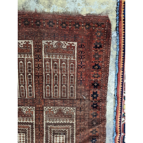 27 - An Afghan red ground prayer rug, 166 x 120cm