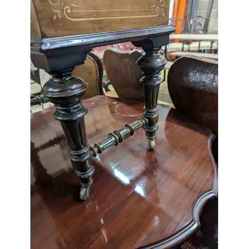 29 - A late Victorian inlaid walnut enclosed Canterbury, width 48cm, depth 31cm, height 68cm