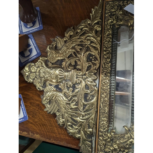 32 - A 19th century Dutch embossed brass wall mirror, width 45cm, height 75cm
