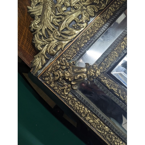 32 - A 19th century Dutch embossed brass wall mirror, width 45cm, height 75cm