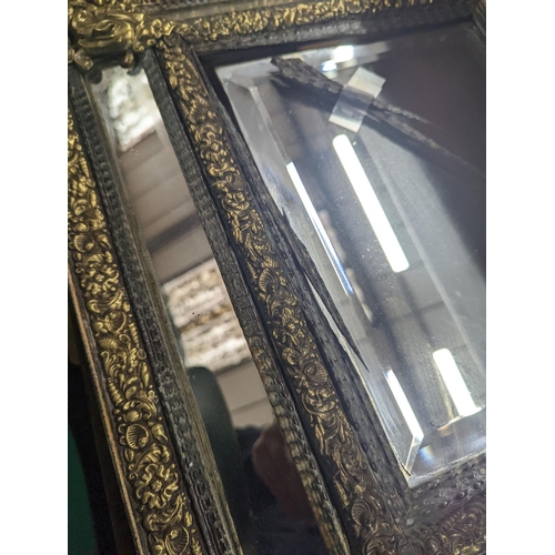 32 - A 19th century Dutch embossed brass wall mirror, width 45cm, height 75cm