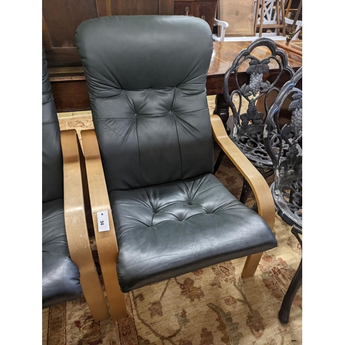 34 - A pair of mid century Norwegian green leather and bent ply armchairs, width 68cm, depth 80cm, height... 