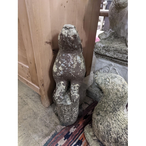 42 - Four reconstituted stone garden ornaments modelled as a flower seller, height 102cm, hare, seal and ... 