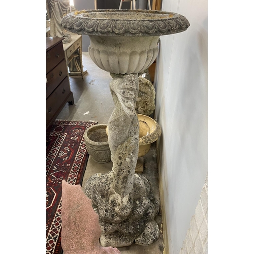 1005 - A large reconstituted stone dolphin garden planter, height 132cm