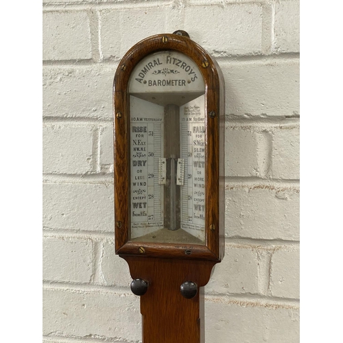 1014 - A Victorian oak cased Admiral Fitzroys stick barometer and thermometer, height 102cm