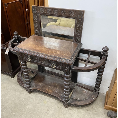 1017 - A late Victorian carved oak hall stand with mirror, width 125cm