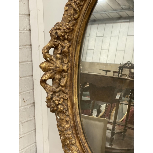 1022 - An oval giltwood and gesso wall mirror, width 89cm, height 108cm